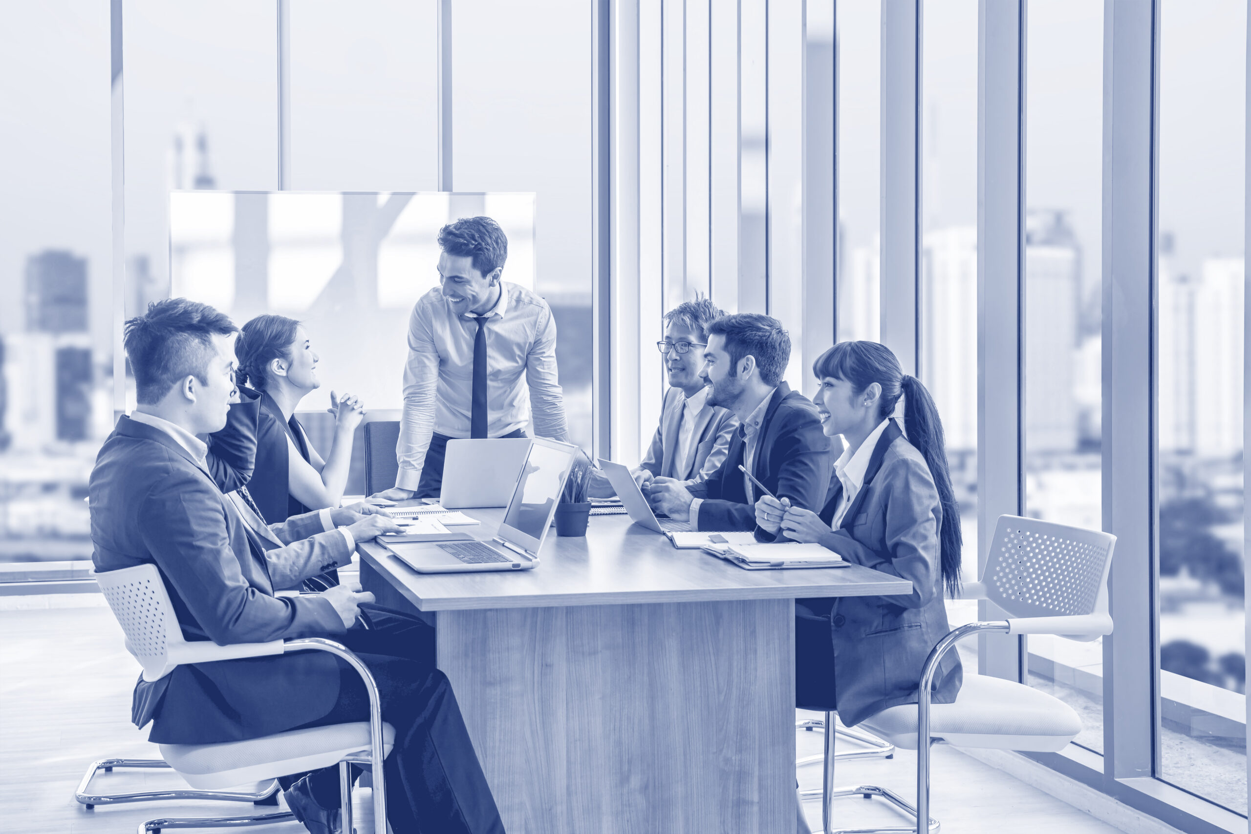 Businesspeople discussing together in conference room during mee