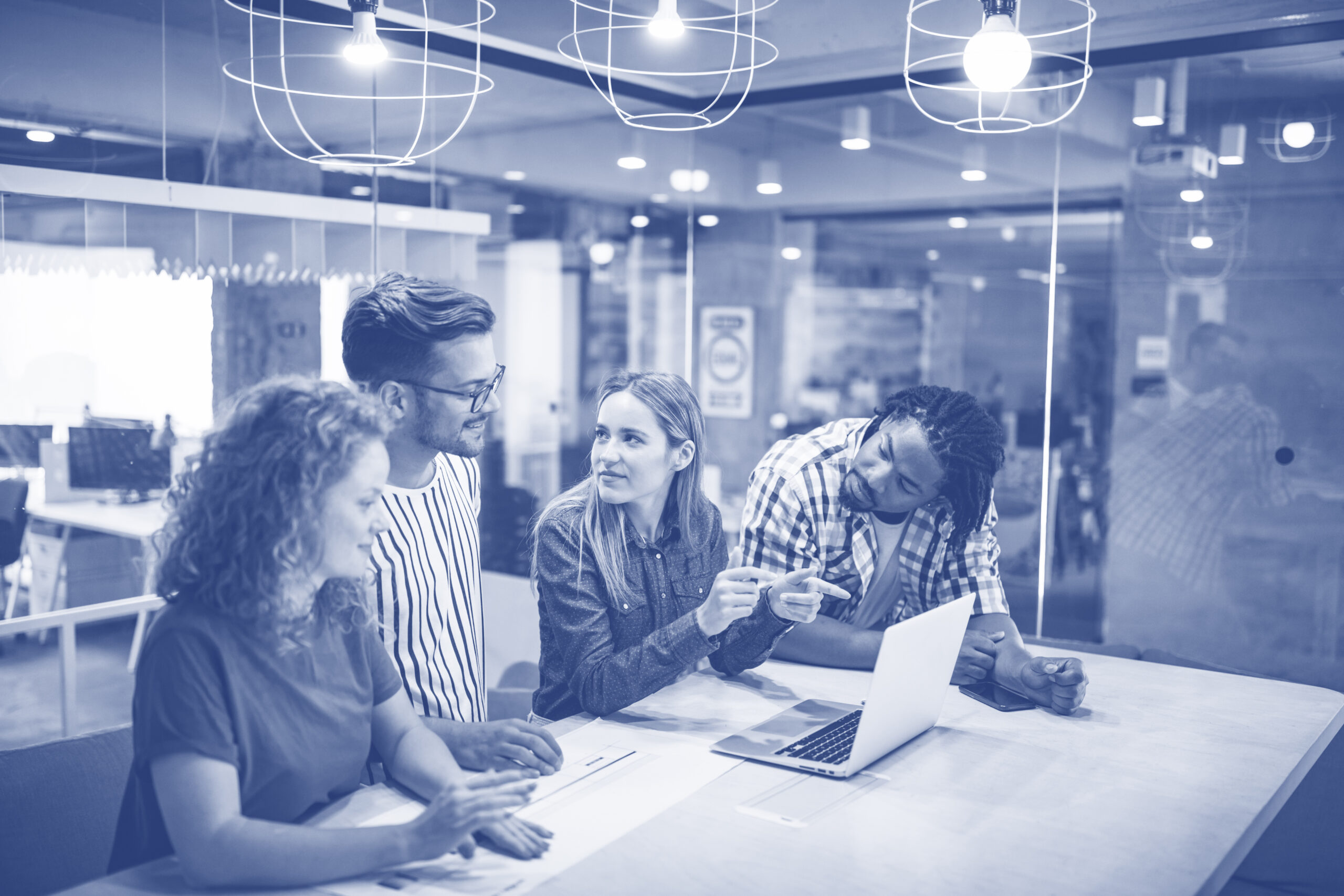 Successful group of designers, business people at work in office