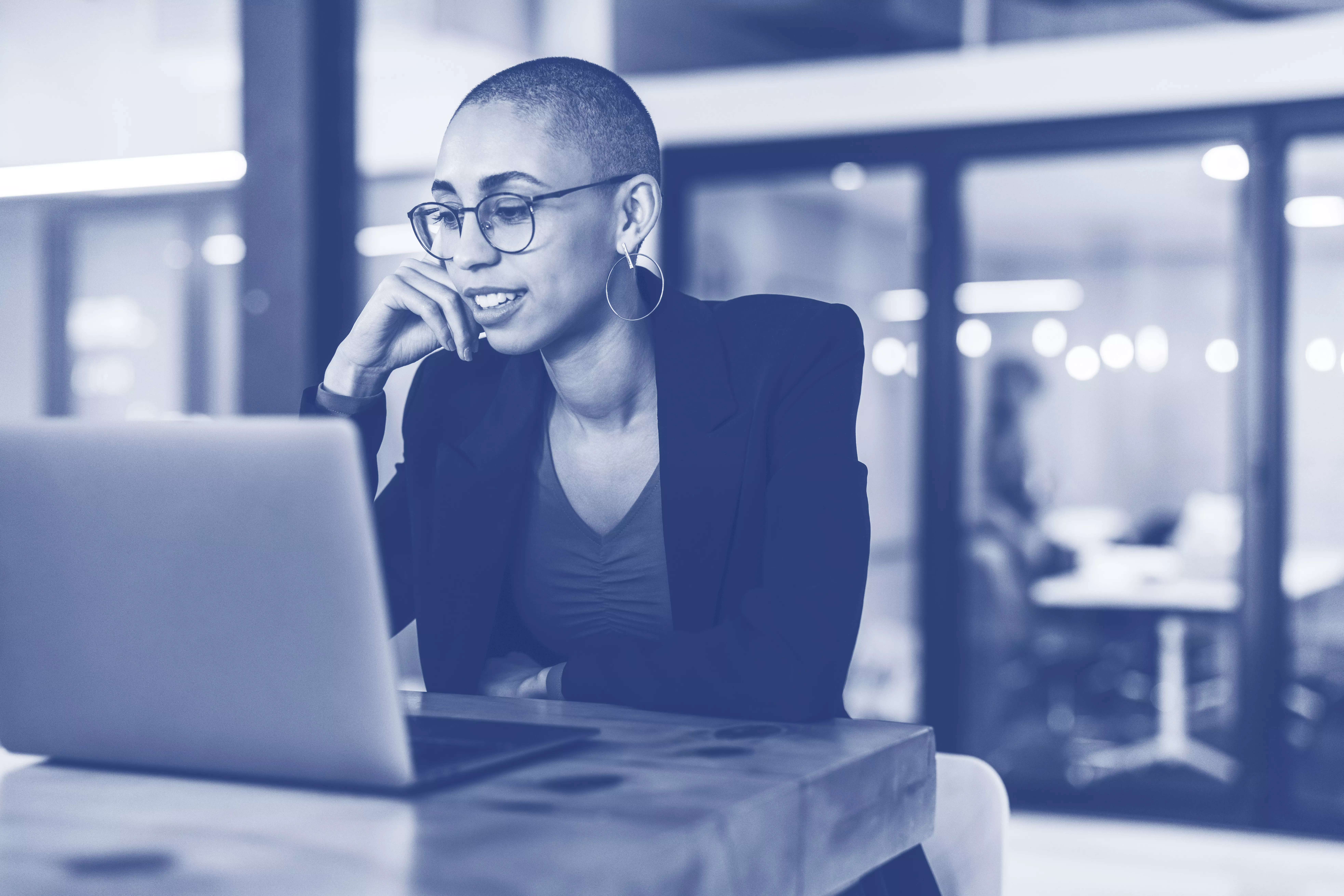 Young businesswoman attending a virtual meeting in an office