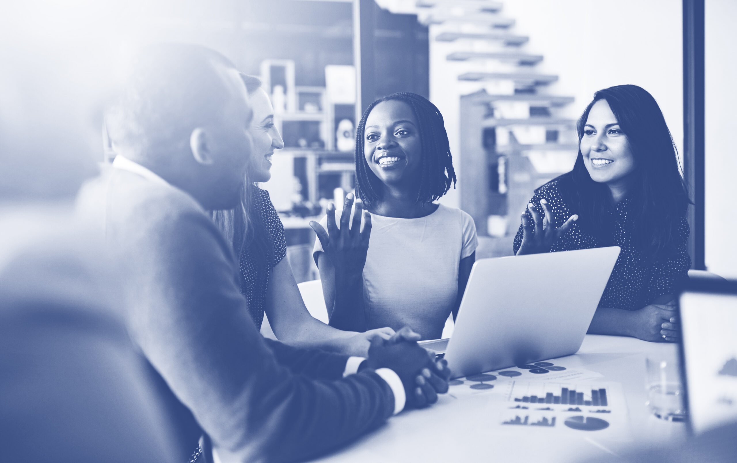Business people, conversation and laptop data with planning and strategy in office. Training, communication and online chart with corporate paperwork and working on a teamwork project with diversity