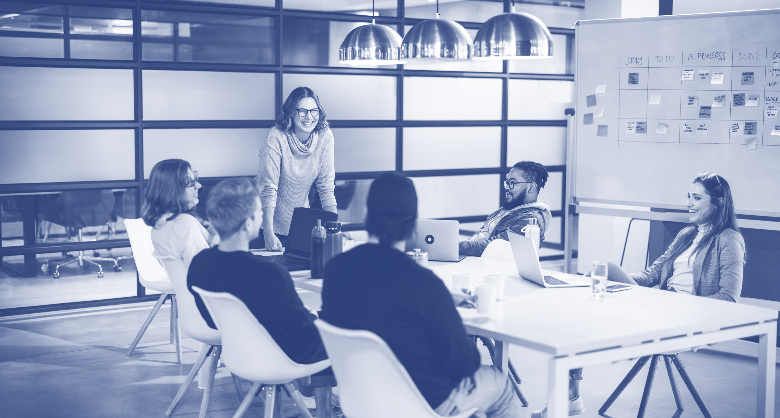Creative business team: Boardroom brainstorming with a scrum master