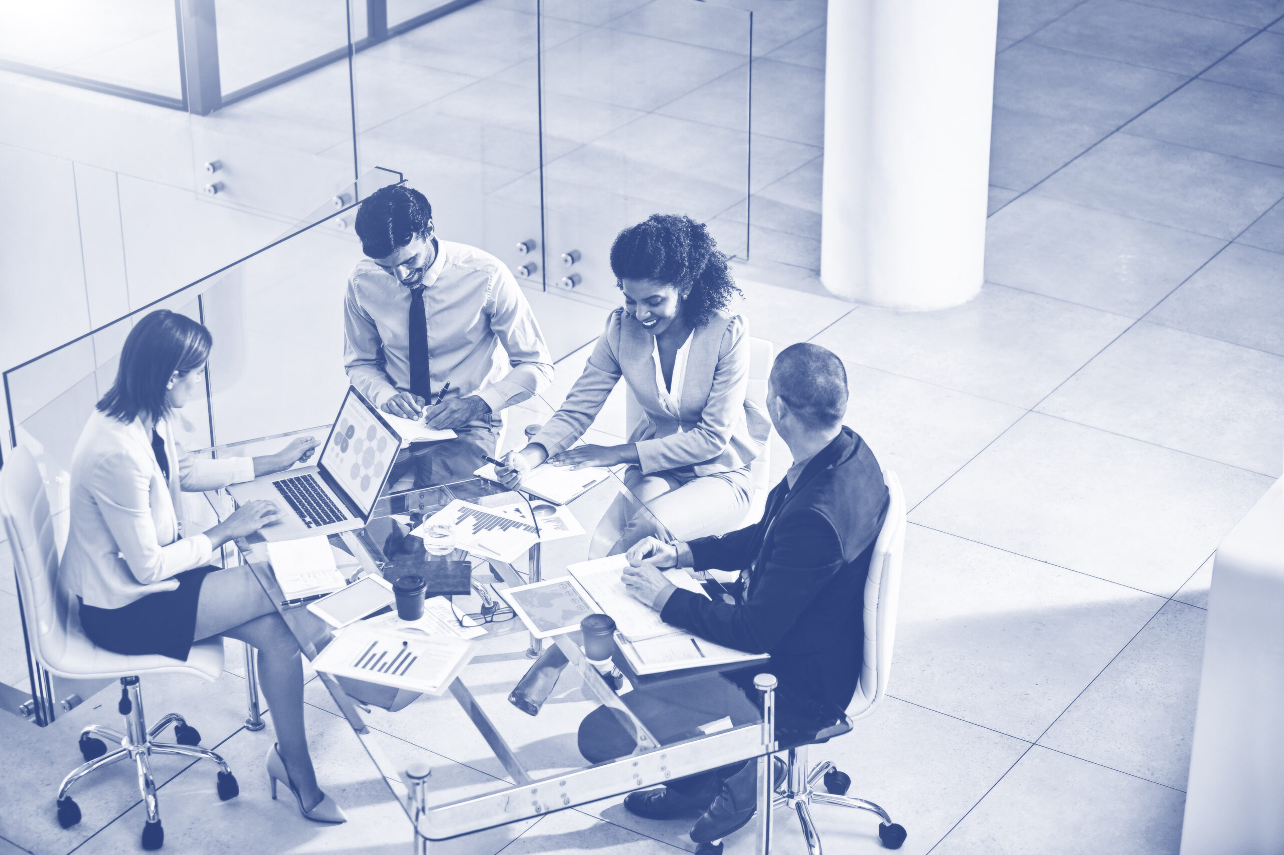 Team, business people and manager with laptop on table for financial meeting, pitch or presentation. Group, accountant and collaboration in office with computer for investment, documents for strategy