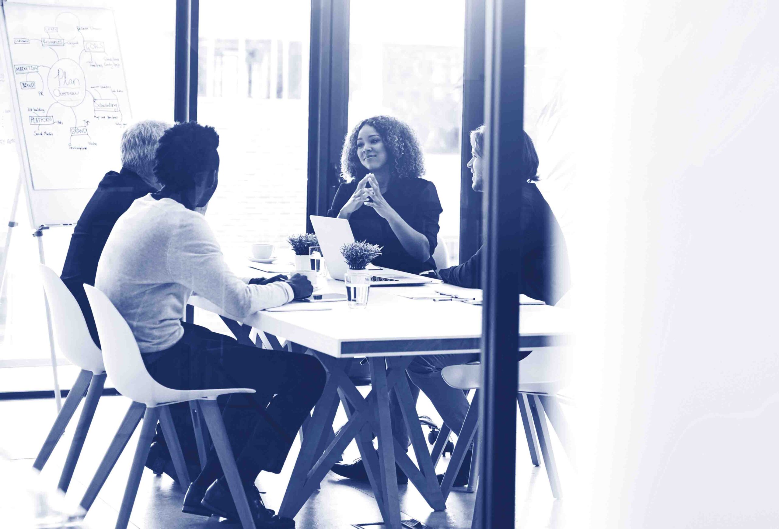 Running through some of their big ideas together. Shot of a group of businesspeople having a boardroom meeting in an office.