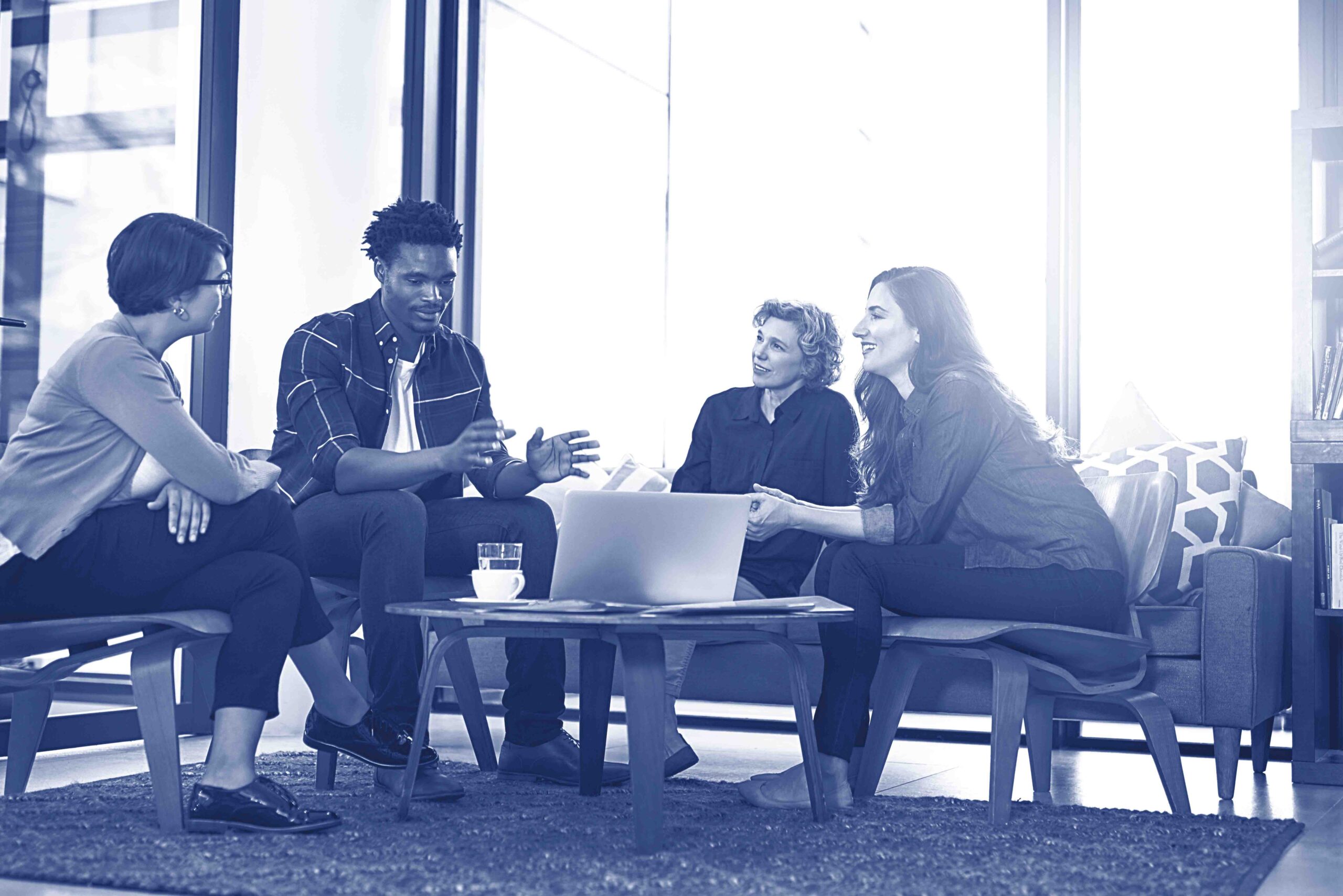 Watch the pros work. Shot of a team of creative businesspeople brainstorming around a laptop in the office.